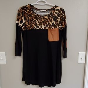 Women's leopard/black tunic with arm patches.
